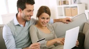 Woman and man sitting on the couch.